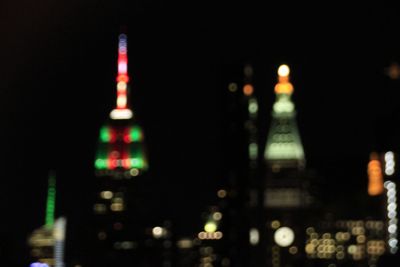 Defocused image of illuminated buildings at night