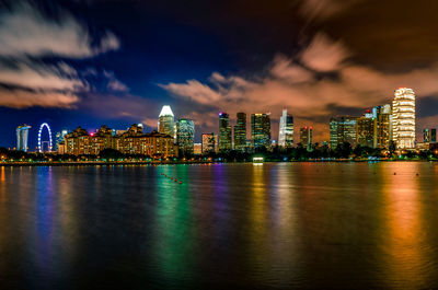 Illuminated city at waterfront