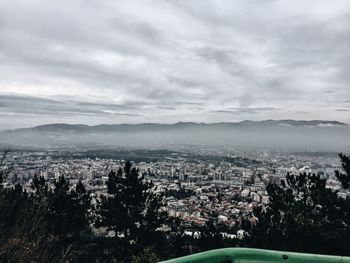 Aerial view of cityscape against sky