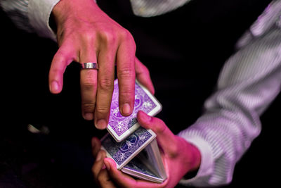 Close-up of hands holding mobile phone