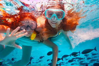 High angle view of woman swimming in pool