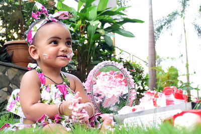 Portrait of cute girl with pink flower