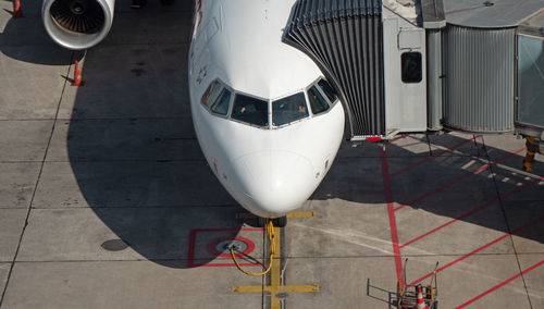 High angle view of airplane on airport runway