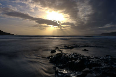 Scenic view of sea against sky during sunset