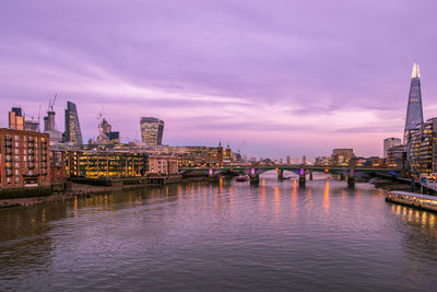 Bridges over river thames with skyscrapers in background