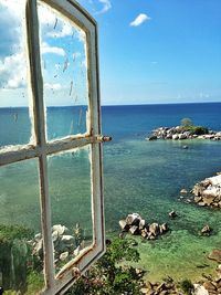 Scenic view of sea against blue sky