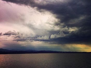 Scenic view of sea against cloudy sky