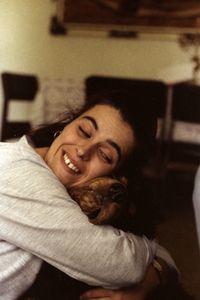 Portrait of smiling young woman at home