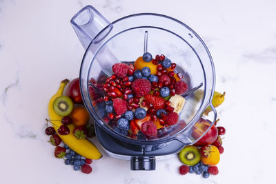 High angle view of strawberries in bowl on table