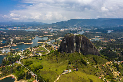 High angle view of city and mountains against sky