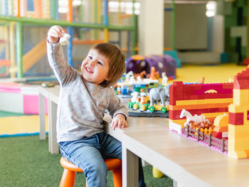 Boy playing with toys 