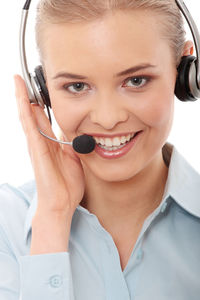 Portrait of a smiling young woman using smart phone