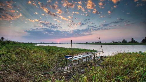 Scenic view of land against sky during sunset