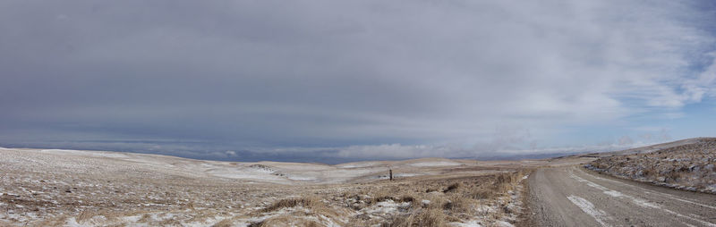 Road by land against sky