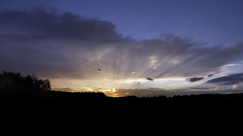 Scenic view of silhouette landscape against sky during sunset