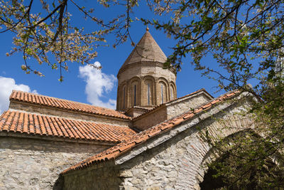 Low angle view of bell tower against sky