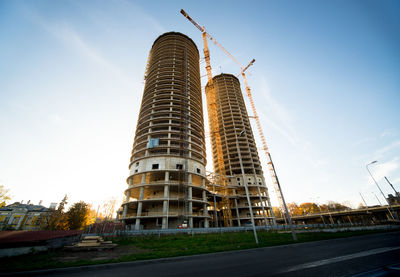 Low angle view of incomplete buildings against sky