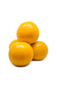 Close-up of oranges against white background