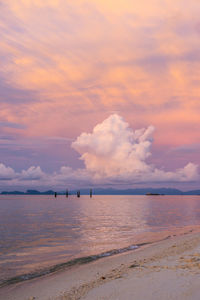 Scenic view of beach against sky during sunset