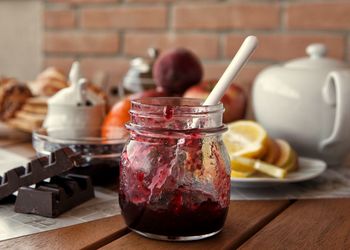 Close-up of ice cream in jar on table