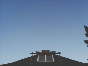 Low angle view of built structure against blue sky