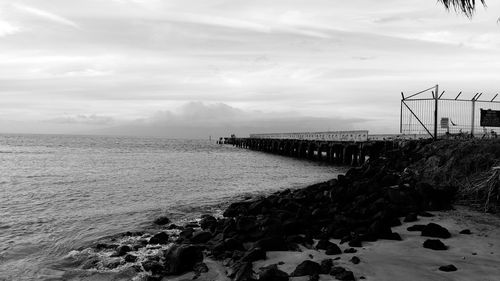 Pier over sea against sky