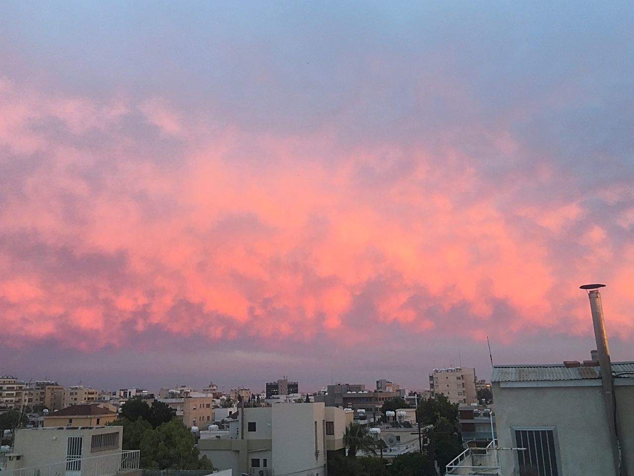 VIEW OF CITYSCAPE AGAINST SKY