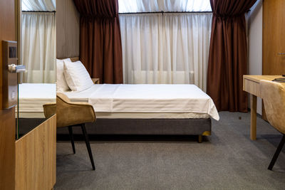 Empty chair on table at hotel room