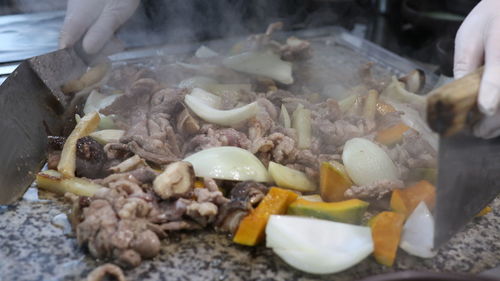 Close-up of person preparing food