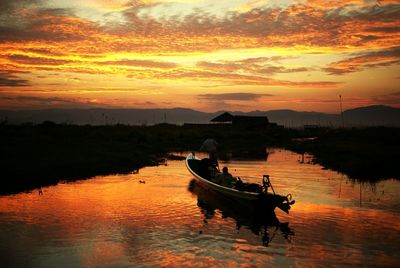 Scenic view of calm lake at sunset