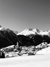 Scenic view of snowcapped mountains against clear sky