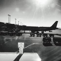 Airplane on runway against sky