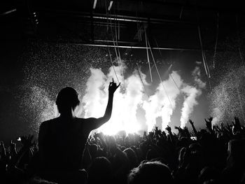 Silhouette people at music concert