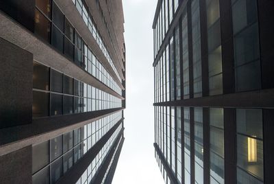 Low angle view of office building against sky