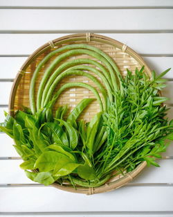 High angle view of green leaves on table