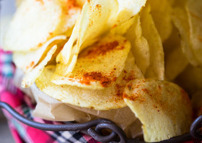 Close-up of potato chips in container