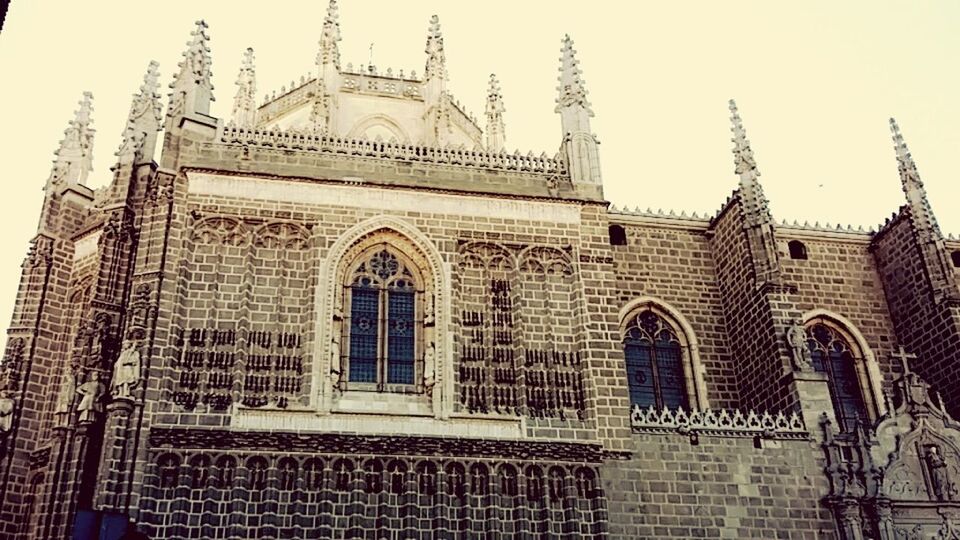 architecture, built structure, building exterior, place of worship, religion, spirituality, low angle view, history, no people, day, window, outdoors, travel destinations, clear sky, sky