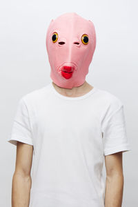 Midsection of man wearing mask against white background