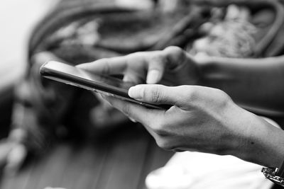 Close-up of man using mobile phone