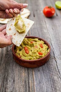 Close-up of hand preparing food