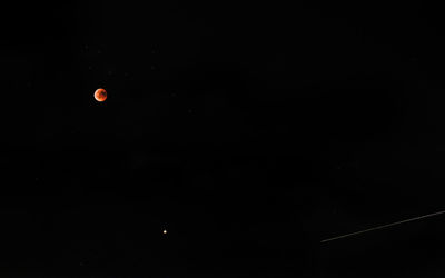 Low angle view of moon in sky at night