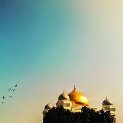 Exterior of mosque against clear sky