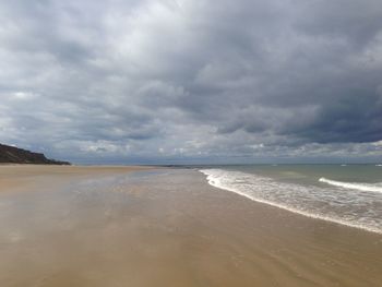 Scenic view of beach against sky