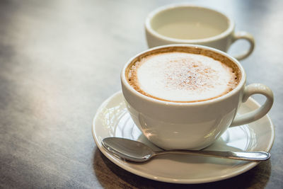 Close-up of coffee cup on table