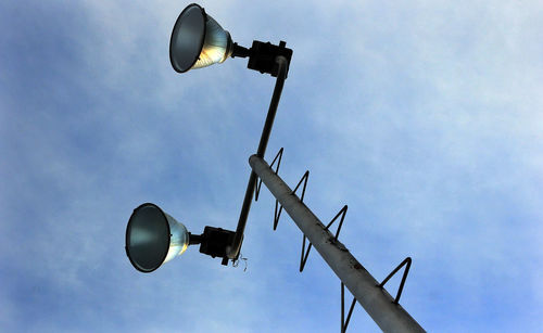 Low angle view of street light against sky