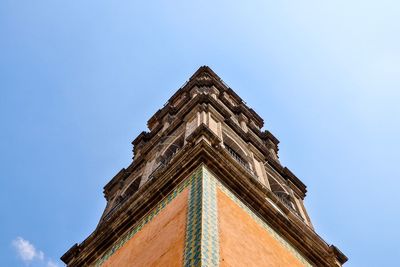 Low angle view of historic building against clear blue sky