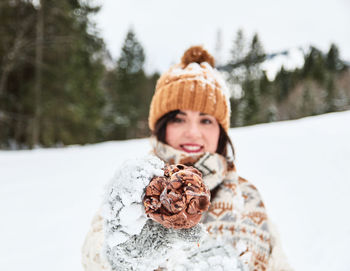 Portrait of young woman in snow