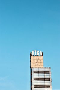 Low angle view of building against blue sky