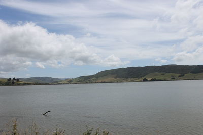 View of lake against cloudy sky