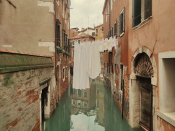 Canal amidst buildings in town